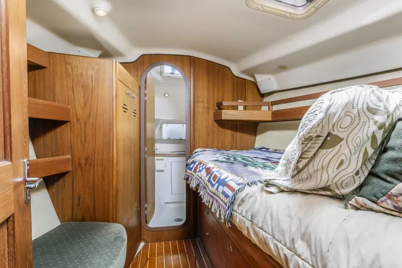 Slide: The Image of Cozy cabin interior of 1997 Hunter 456 yacht with bed and bathroom. - 34