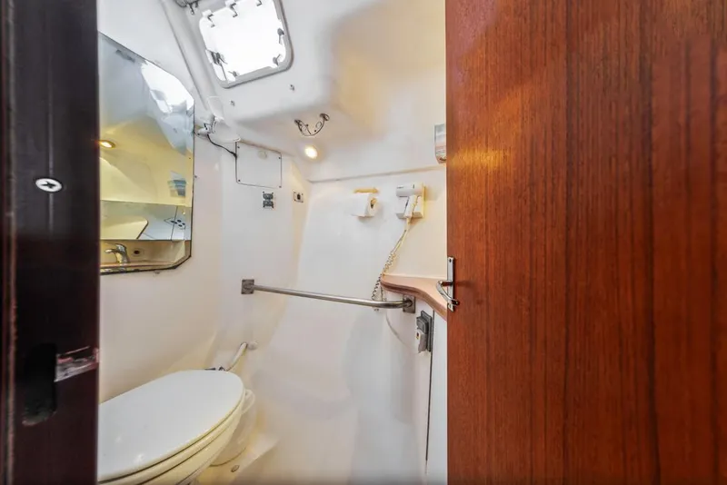 Slide: The Image of Compact bathroom interior of 1997 Hunter 456 yacht with toilet and mirror. - 39