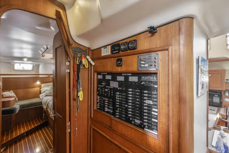 Slide: The Image of Interior of 1997 Hunter 456 yacht with control panel and cozy cabin. - 41