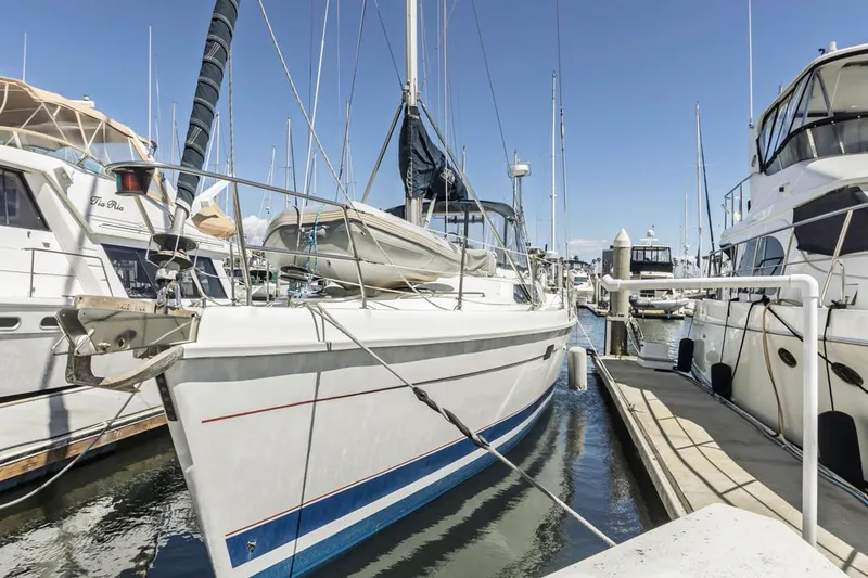 Slide: The Image of Sailboat docked at marina, Hunter 456 model, 1997, surrounded by other boats. - 7