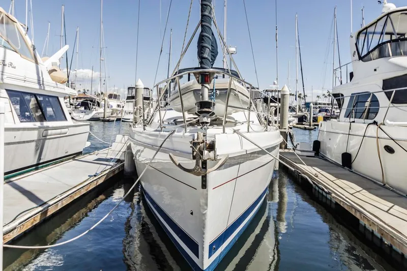 Slide: The Image of Sailboat docked in marina, Hunter 456 model, 1997, surrounded by other boats. - 8