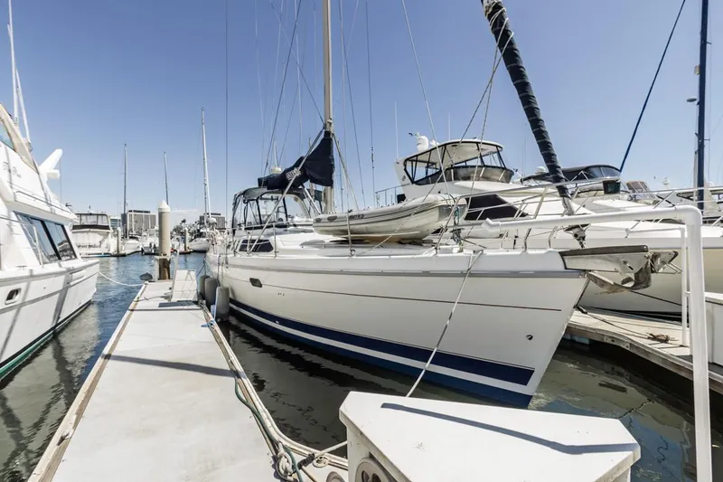 Slide: The Image of Sailboat docked at marina, Hunter 456 model, 1997, clear sky background. - 9