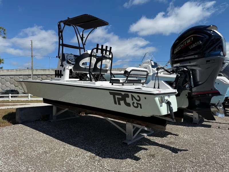 Slide: The Image of 2025 Tidewater 25 TPC Raptor boat with Yamaha engine on display outdoors. - 1