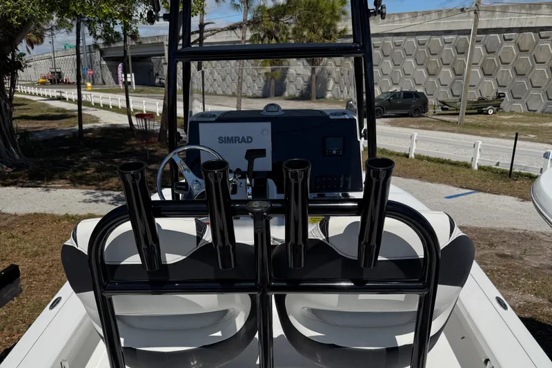 Slide: The Image of 2025 Tidewater 25 TPC Raptor boat with Simrad navigation system and rod holders. - 12