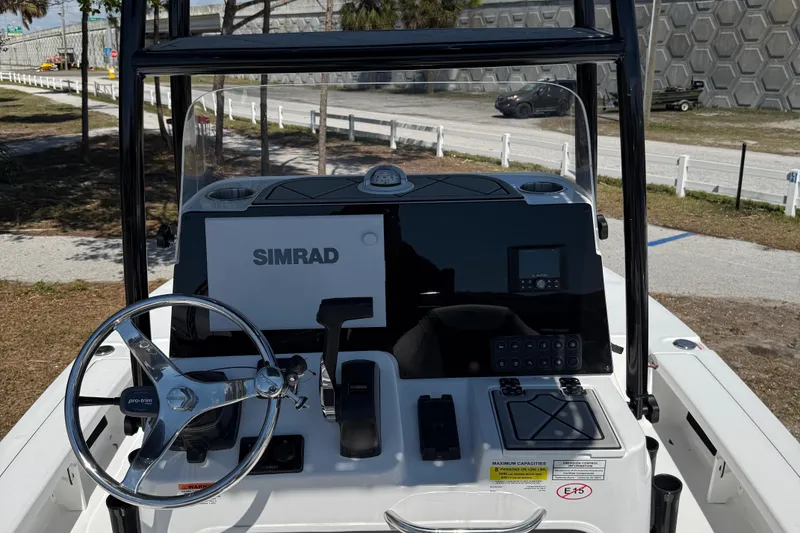 Slide: The Image of 2025 Tidewater 25 TPC Raptor boat console with Simrad electronics and steering wheel. - 14