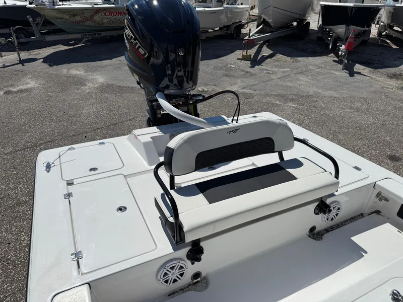 Slide: The Image of 2025 Tidewater 25 TPC Raptor boat with outboard motor and seating area. - 3