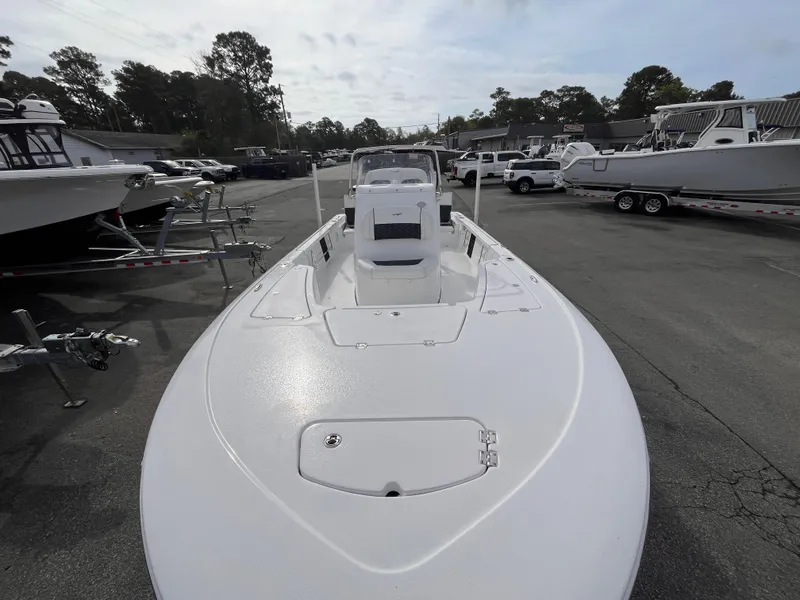 Slide: The Image of 2025 Tidewater 2110 Bay Max boat in a marina, front view. - 11