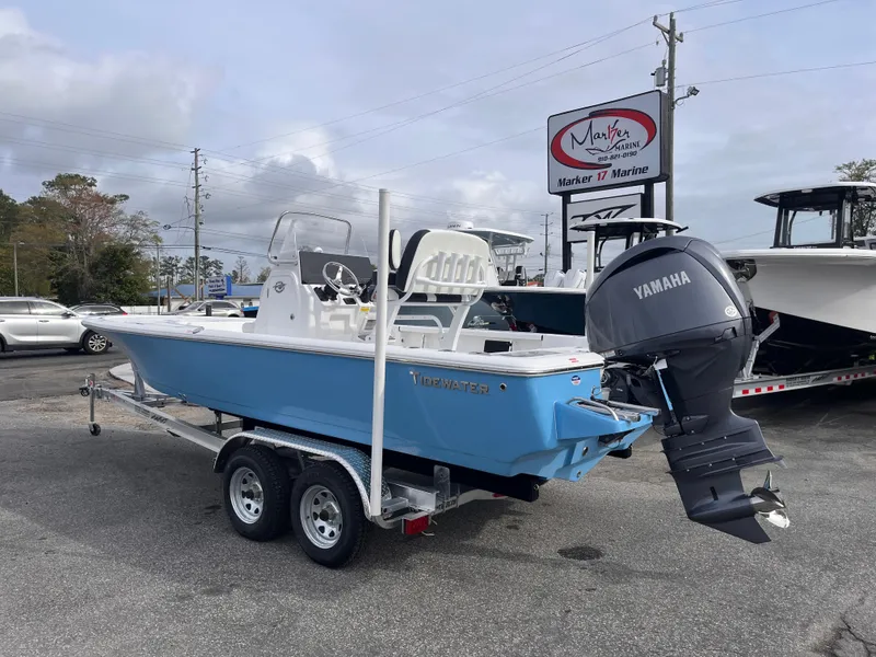 Slide: The Image of 2025 Tidewater 2110 Bay Max boat on trailer with Yamaha engine at marina. - 2