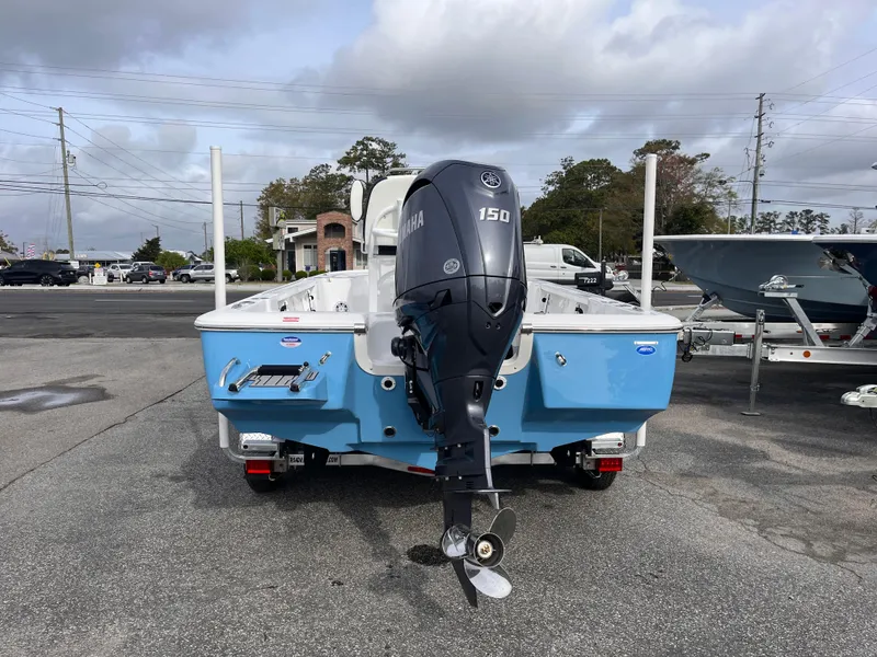 Slide: The Image of 2025 Tidewater 2110 Bay Max boat with Yamaha 150 engine, parked outdoors. - 3