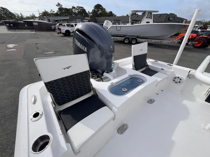 Slide: The Image of 2025 Tidewater 2110 Bay Max boat with Yamaha engine, featuring seating and storage. - 6