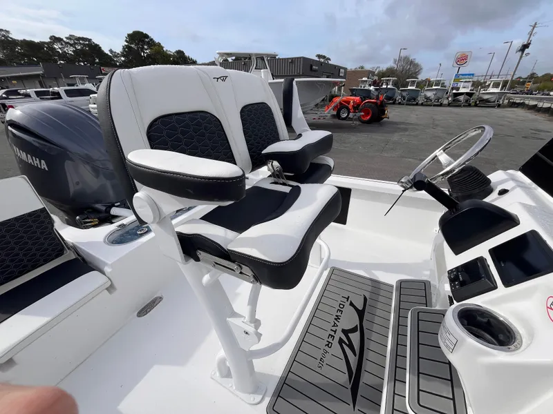 Slide: The Image of 2025 Tidewater 2110 Bay Max boat interior with dual seats and steering console. - 7