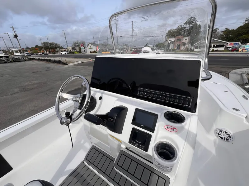 Slide: The Image of 2025 Tidewater 2110 Bay Max boat console with steering wheel and controls. - 8