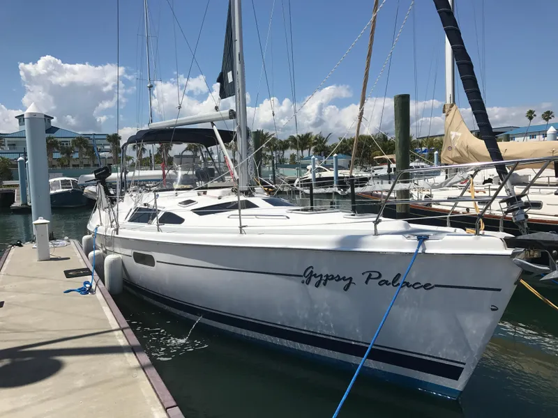 Slide: The Image of 2003 Hunter Passage 420 sailboat docked at marina under clear skies. - 1