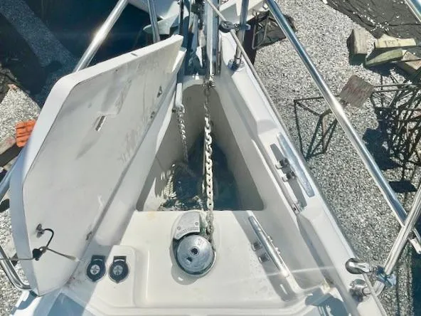 Slide: The Image of Anchor locker of 2003 Hunter Passage 420 sailboat with chain and winch. - 12