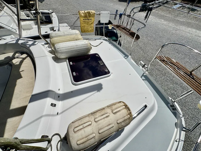 Slide: The Image of Deck of 2003 Hunter Passage 420 sailboat with fenders and hatch. - 20