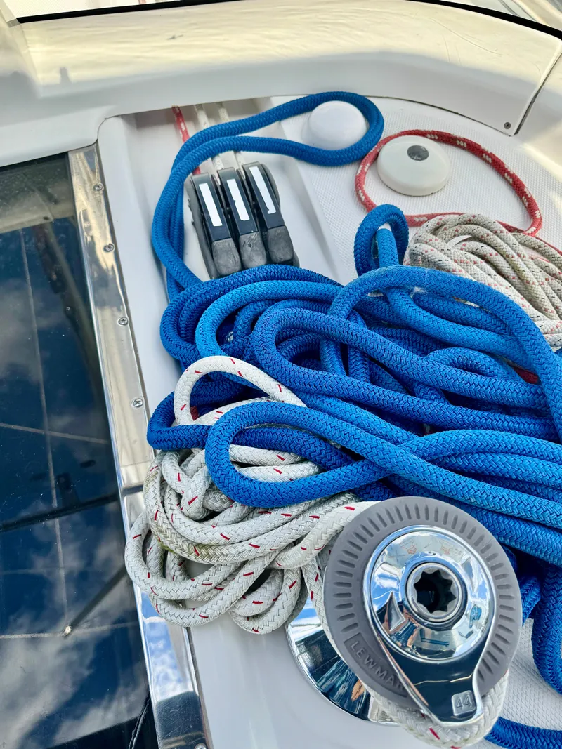 Slide: The Image of Coiled ropes and winch on 2003 Hunter Passage 420 sailboat deck. - 28