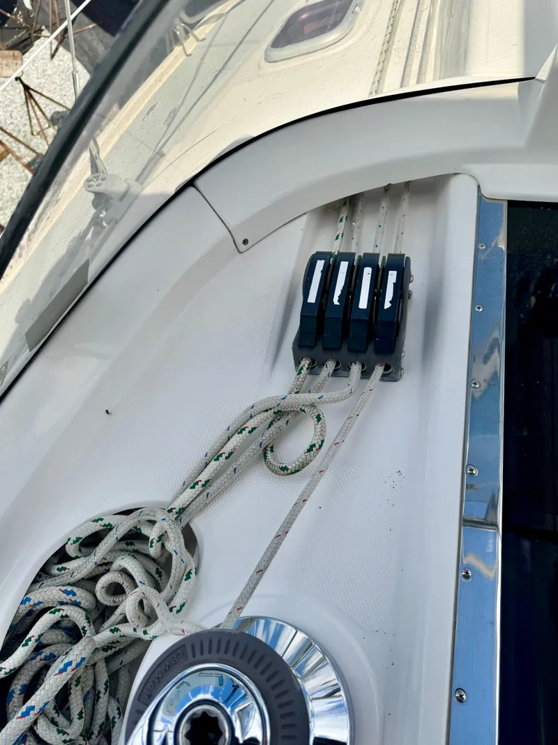 Slide: The Image of Deck of 2003 Hunter Passage 420 sailboat with ropes and cleats. - 29