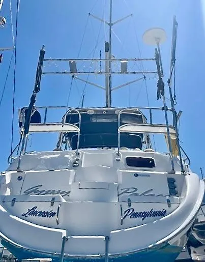Slide: The Image of 2003 Hunter Passage 420 sailboat docked under clear blue sky. - 3