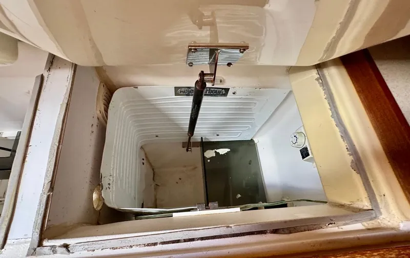 Slide: The Image of Open storage compartment in 2003 Hunter Passage 420 boat interior. - 36