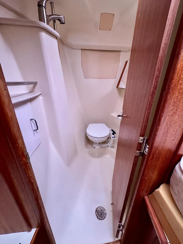 Slide: The Image of 2003 Hunter Passage 420 yacht bathroom with toilet and shower. - 40