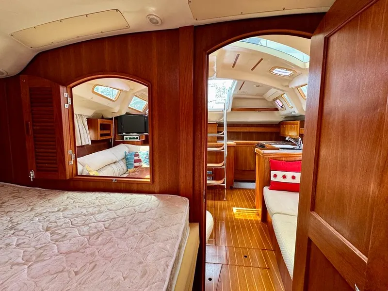Slide: The Image of Interior of 2003 Hunter Passage 420 yacht with wood finish and cozy seating area. - 43