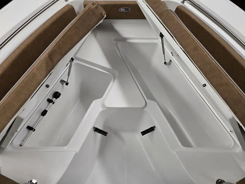 Slide: The Image of Interior view of 2025 Sea Hunt Ultra 229 boat, featuring spacious seating and storage compartments. - 15