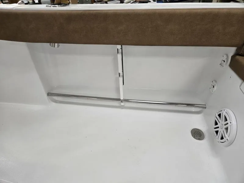 Slide: The Image of Interior view of 2025 Sea Hunt Ultra 229 boat, featuring seating and speaker. - 2