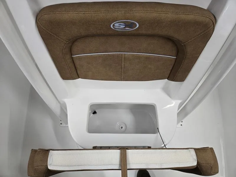 Slide: The Image of 2025 Sea Hunt Ultra 229 boat seat and storage compartment. - 20