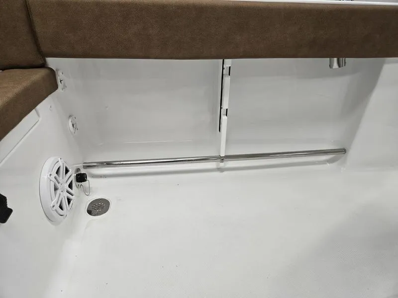 Slide: The Image of Interior view of 2025 Sea Hunt Ultra 229 boat, featuring seating and speaker. - 21