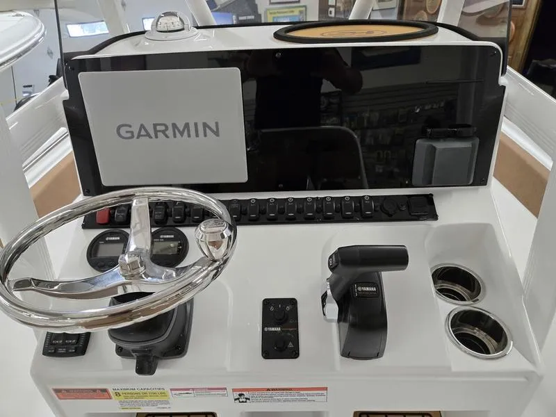 Slide: The Image of Control panel of 2025 Sea Hunt Ultra 229 boat with Garmin navigation system. - 9