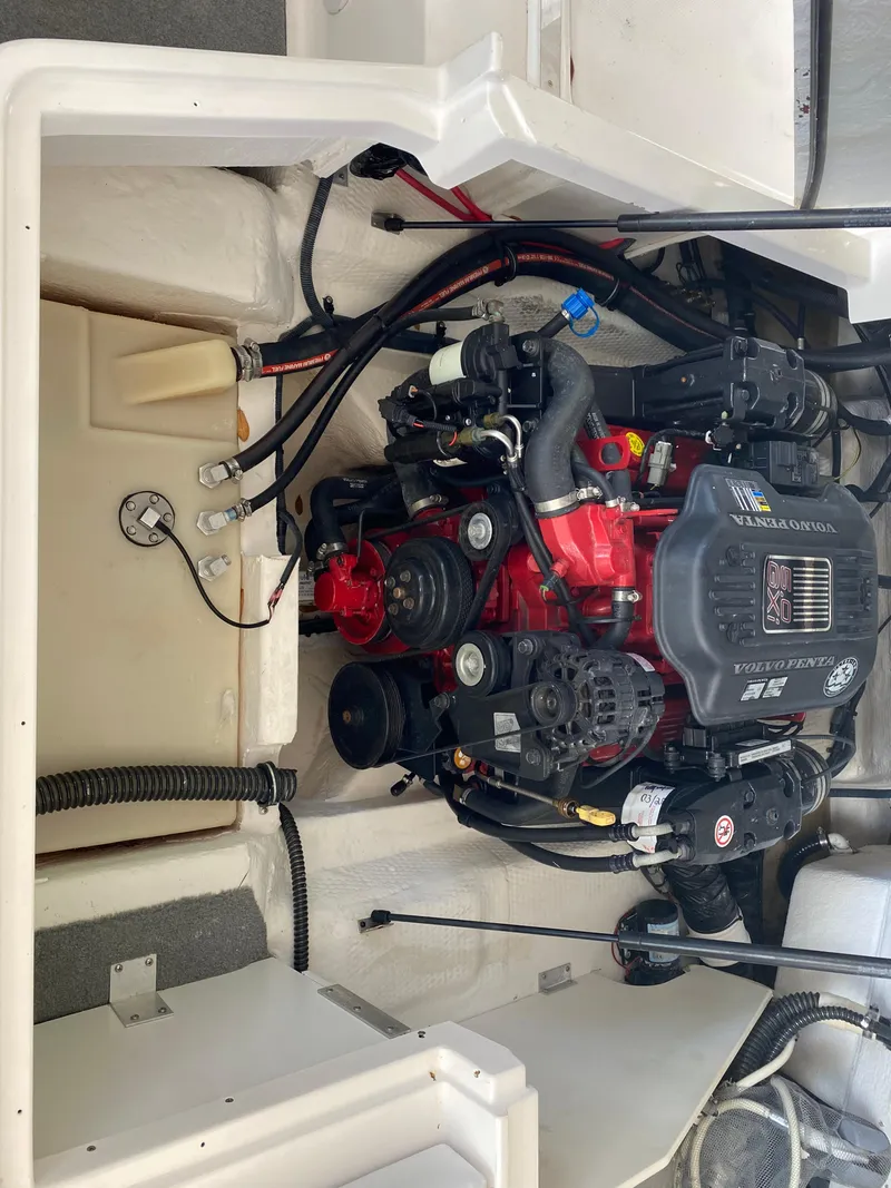 Slide: The Image of 2008 Regal 2200 Bowrider engine compartment with visible components and wiring. - 12