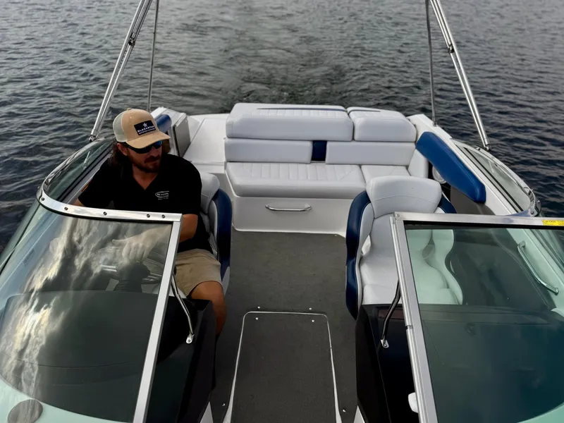 Slide: The Image of 2008 Regal 2200 Bowrider on water, featuring spacious seating and sleek design. - 5