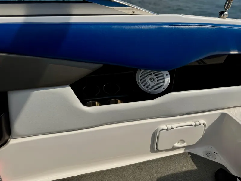 Slide: The Image of 2008 Regal 2200 Bowrider interior detail with blue upholstery and speaker. - 6