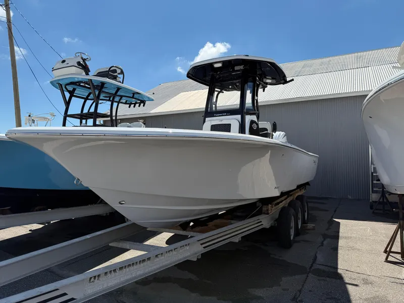 Slide: The Image of 2025 Tidewater 2500 Carolina Bay boat on trailer, parked outdoors. - 0