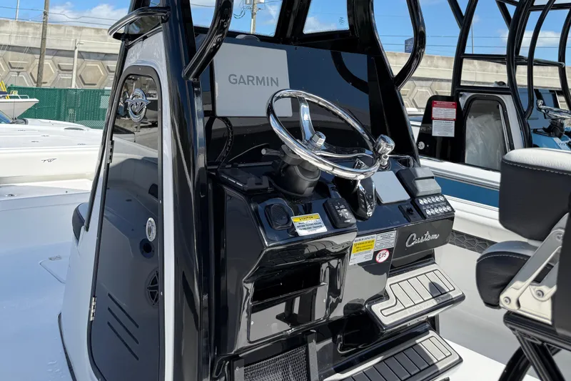 Slide: The Image of 2025 Tidewater 2500 Carolina Bay boat console with Garmin navigation system. - 10