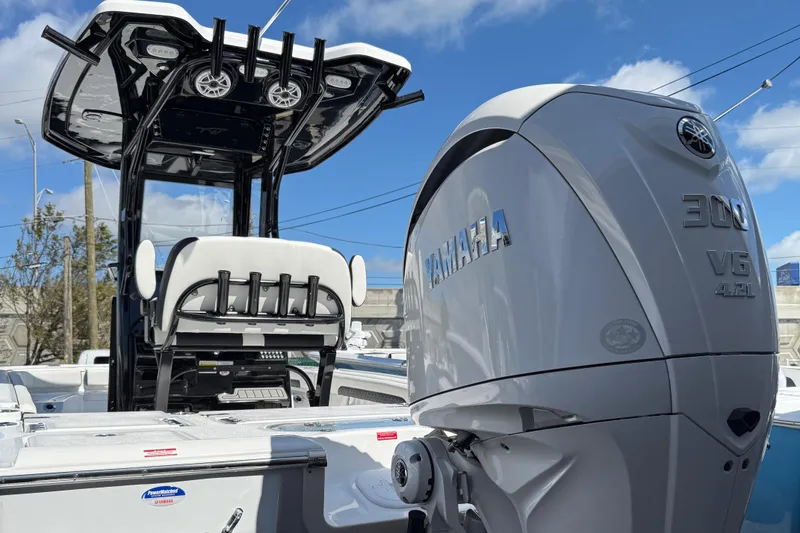 Slide: The Image of 2025 Tidewater 2500 Carolina Bay boat with Yamaha engine, sleek design, and modern features. - 6