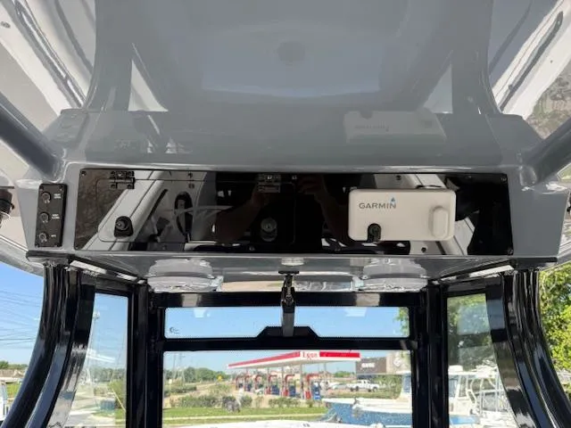 Slide: The Image of 2025 Tidewater 320 CC Adventure boat console with Garmin electronics. - 13