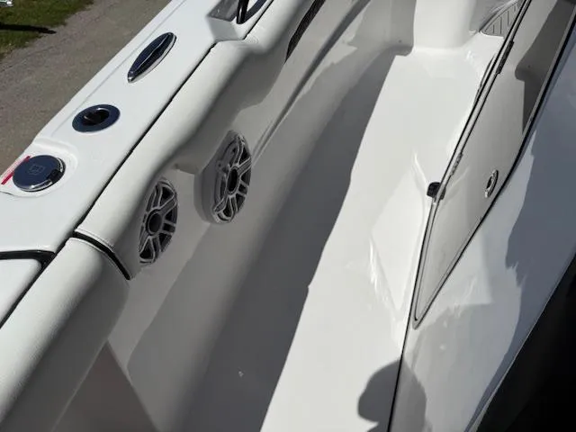 Slide: The Image of 2025 Tidewater 320 CC Adventure boat interior with speakers and sleek design. - 17