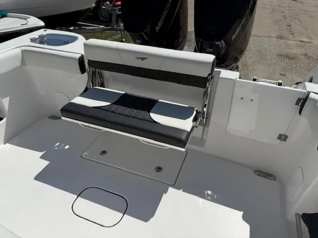 Slide: The Image of 2025 Tidewater 320 CC Adventure boat with sleek seating and dual outboard motors. - 24