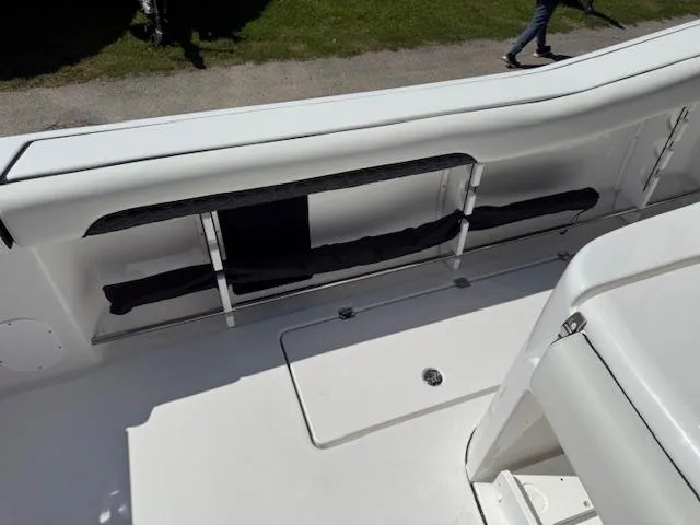 Slide: The Image of 2025 Tidewater 320 CC Adventure boat interior with storage compartments. - 8