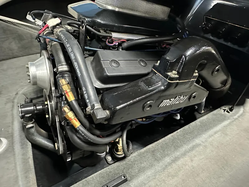 Slide: The Image of 2002 Malibu Sunsetter engine compartment with visible components and wiring. - 19