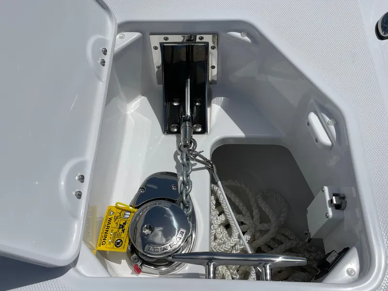 The Image of 2025 Everglades 273CC boat on trailer under clear blue sky. - 1