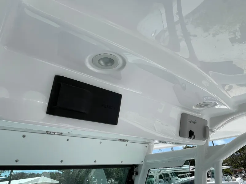Slide: The Image of 2025 Everglades 273CC boat interior ceiling with Garmin electronics and lighting. - 13