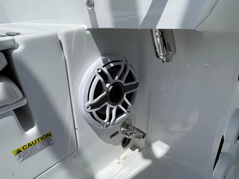Slide: The Image of 2025 Everglades 273CC boat speaker and caution label detail. - 14