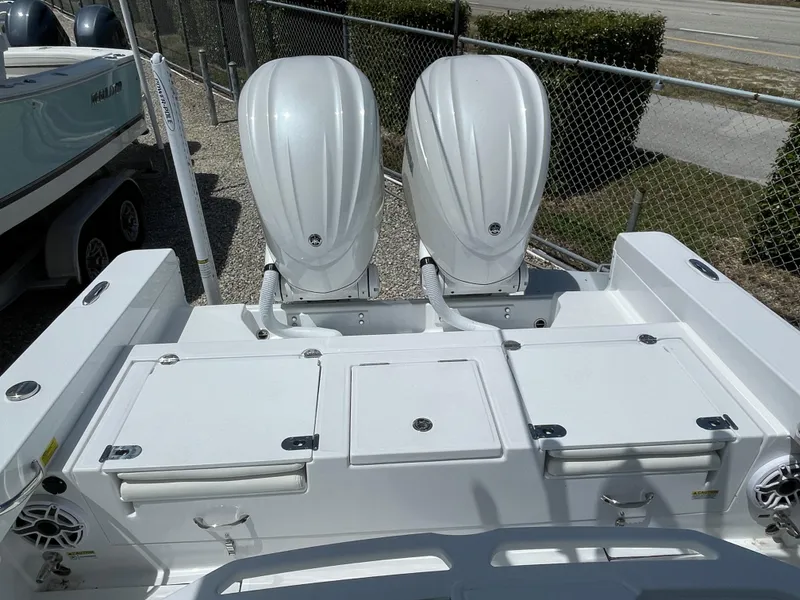 Slide: The Image of 2025 Everglades 273CC boat with dual outboard engines, rear view. - 18