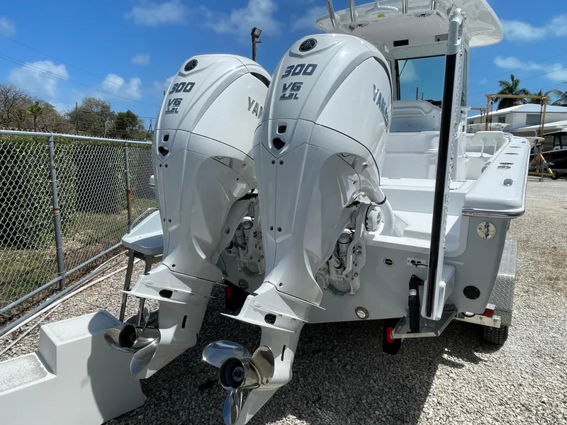 Slide: The Image of 2025 Everglades 273CC boat with dual Yamaha 300 V6 outboard engines. - 23