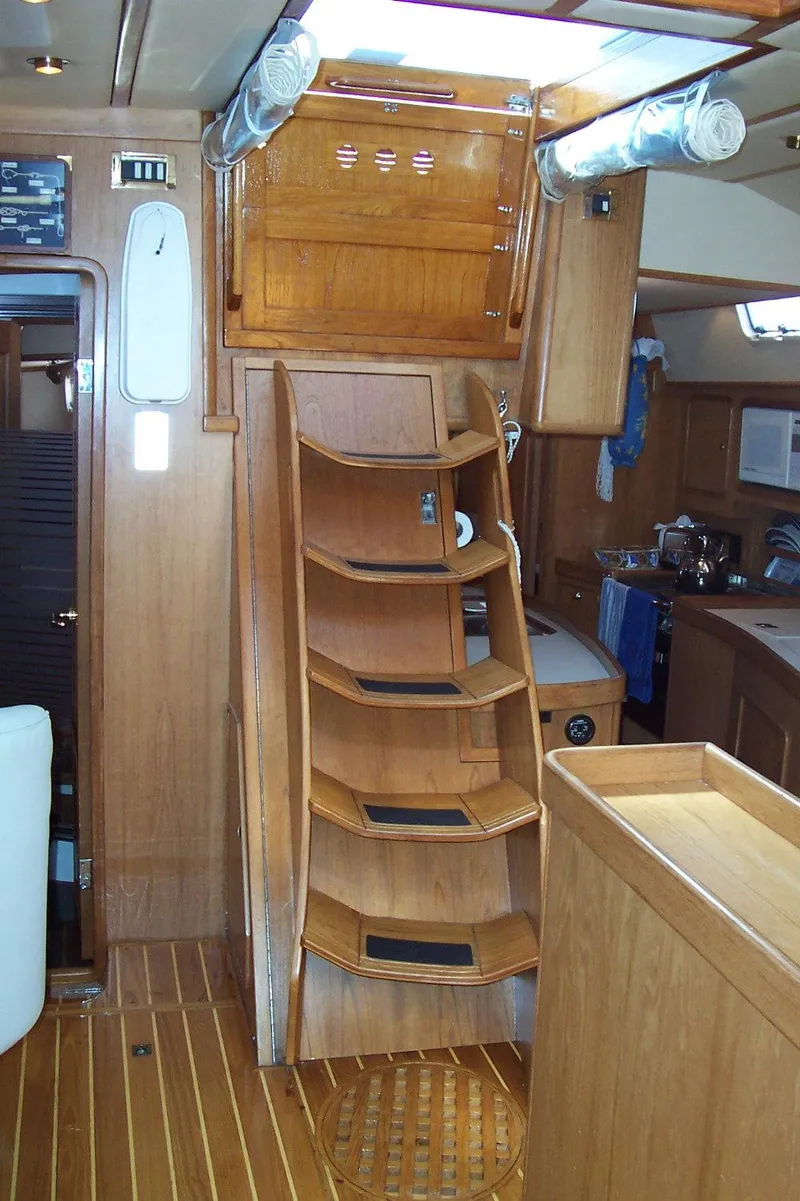 Slide: The Image of Interior of 1994 C&C 51 XL C/B sailboat with wooden stairs and cabinetry. - 12