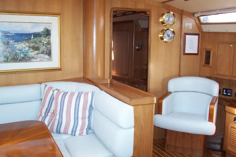 Slide: The Image of Luxurious interior of 1994 C&C 51 XL C/B yacht with plush seating and nautical decor. - 17