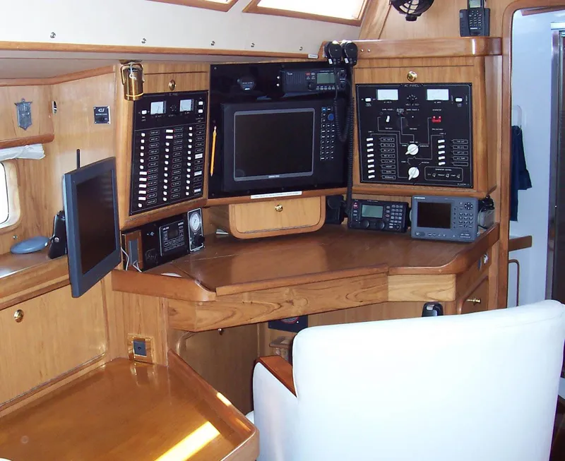 Slide: The Image of Navigation station of 1994 C&C 51 XL C/B yacht with control panels and electronics. - 19