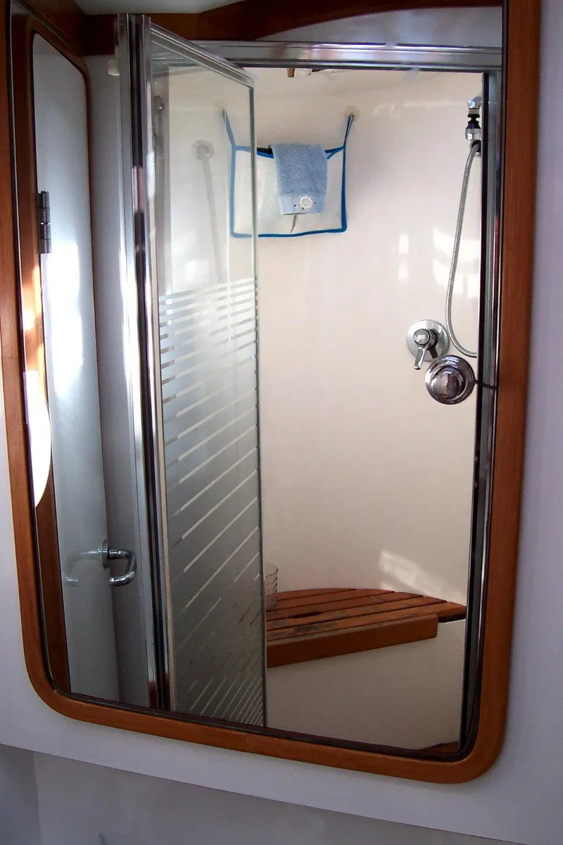 Slide: The Image of Shower area in 1994 C&C 51 XL C/B yacht with wooden seat and glass door. - 30